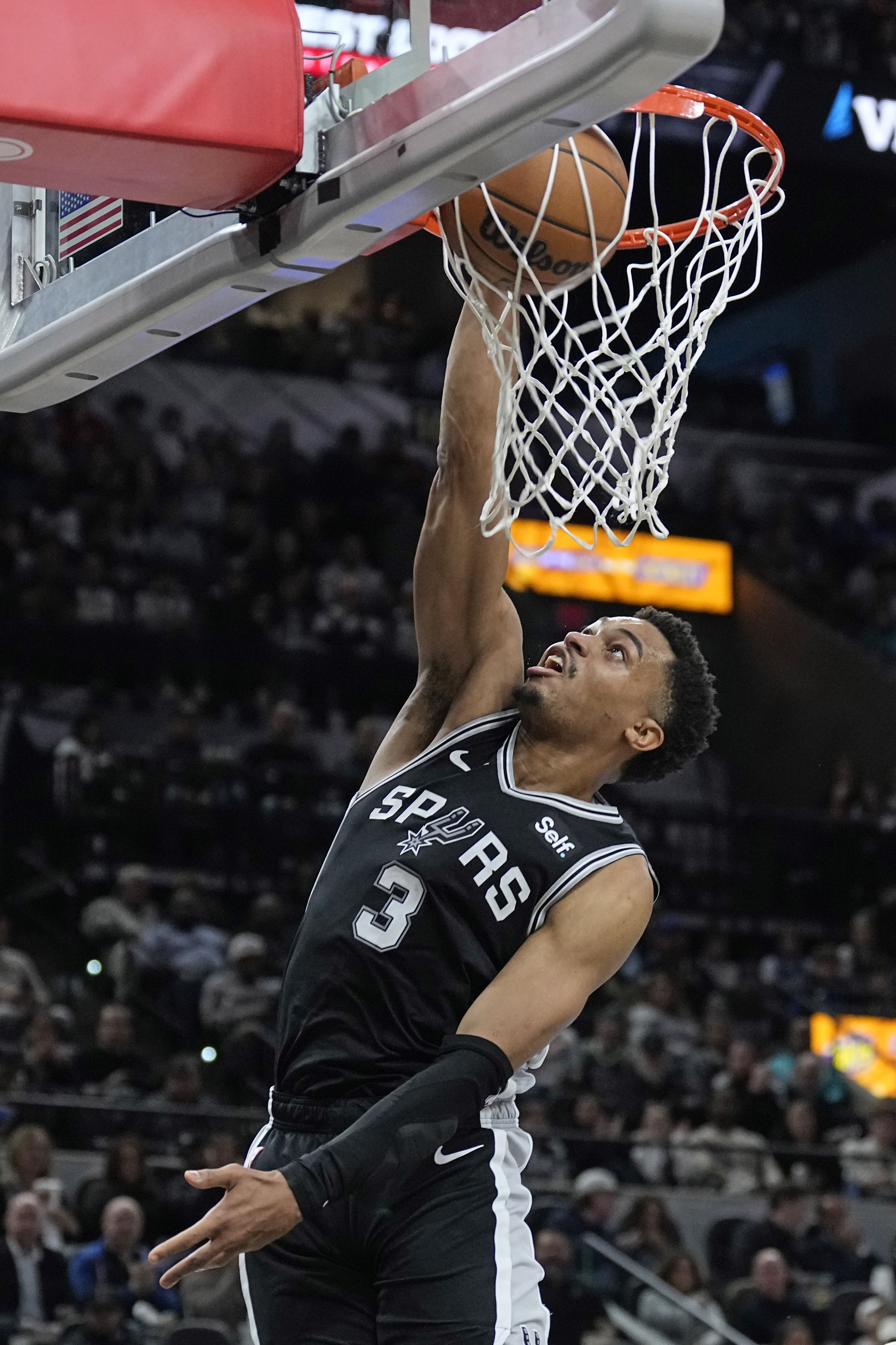 Jan 4, 2024; San Antonio, Texas, USA; San Antonio Spurs forward Keldon Johnson (3) dunks during the second half against the Milwaukee Bucks at Frost Bank Center.